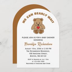 a baby shower with a teddy bear on it's back and brown trim around the edges