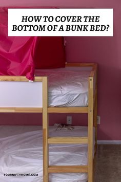 bunk beds with pink walls and text overlay how to cover the bottom of a bunk bed