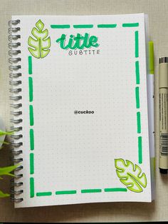 a notebook with the title little gittie written on it next to two pens