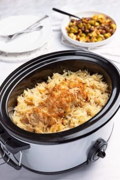 the crockpot pork and kraut is ready to be eaten