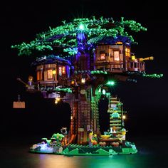 a tree house made out of legos in the dark