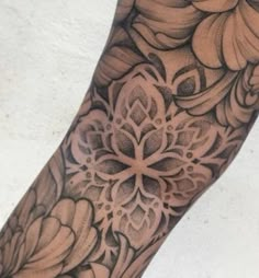 a person with a flower tattoo on their arm