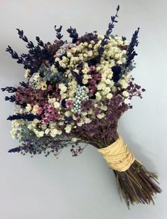 a bunch of flowers that are sitting on a table together with the stems still attached