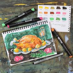 a drawing of a roasted turkey on a plate with crayons and markers next to it