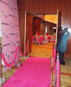 a pink carpeted entrance to a banquet hall