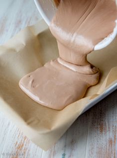 a person is pouring something into a bowl