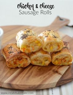 chicken and cheese sausage rolls on a cutting board