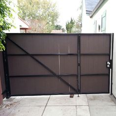 a large brown gate with black bars on it