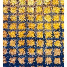 an area rug with yellow and blue colors