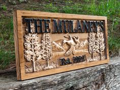 a wooden plaque with an image of the mulannets on it is sitting on a piece of wood