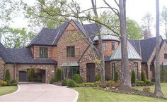 a large brick house with lots of windows