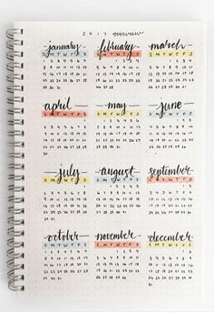 a spiral notebook with the month planner on it