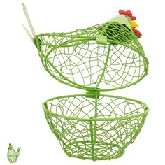 a green wire basket with two chickens in it