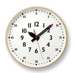 a white clock with red hands and numbers on the face is shown in front of a white background