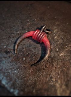 a red and black object on the ground