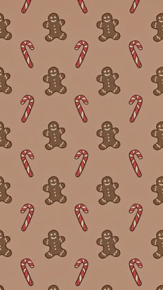 an image of gingerbreads and candy canes on a brown wallpaper background