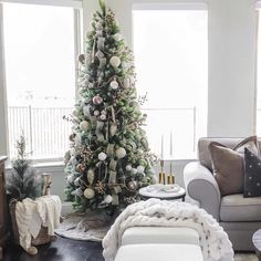 a living room with a christmas tree in the corner