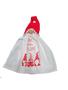 a white bag with red trim on the bottom and an embroidered santa claus hat hanging from it's side