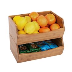 a wooden box filled with oranges, lemons and other fruit on top of each other