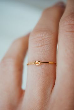 This stacking Knot ring is really cute and easy to wear! The open wire knot adds a bit of extra detail to this otherwise simple hammered stacking ring. This is one single length of metal that is knotted into a secure, open knot and soldered around the back. This ring is a great alternative to a stacking ring! This listing is for ONE SINGLE RING. Each ri...#and #World #Exploring #Elegance #the #Simplicity #Jewelry #Embracing #Beauty #the #Organizers #of #Minimalist #Gemstone #Tidiness #Jewelry Gold Rings For Teenagers, Dainty Ring Designs, Solid Gold Rings Unique, Cute Gold Rings Simple, Simple Small Engagement Rings, Simple Gold Ring Designs Unique, Gold Rings Simple Unique, Hand Rings Gold, Gold Ring Designs Unique