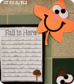 a paper cut out of an orange leaf with words written on it and two eyes