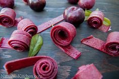 red apple slices are cut up and ready to be used as garnishes