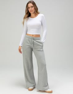 Nike Sportswear Club Fleece Wide Leg Pants. Club Fleece Sweats, Universally Loved For Their Coziness And Consistency, Are For Everyone. Always Soft And Just The Right Weight, They're Basics That Help You Do More. Make Big Moves With All Of The Room In These Wide-Leg, Extra-Long Pants. The Added Length Draws Focus To Your Shoes, So Be Sure To Lace Up Your Favorite Sneakers. Our Best-Selling Fleece For A Reason, Club Fleece Has A Cozy, Familiar Feel And Consistent Fit You Can Return To Again And Again. Brushed For Added Warmth And Softness, It's An Ideal Layer For Colder Temperatures. Pockets Provide Quick Storage For Keys, Phone And Cold Hands. Mid-Rise Waistband. Flat Drawcord. Side Seam Pockets. Embroidered Futura Logo. 80% Cotton, 20% Polyester. Machine Wash. Imported. Model Is Wearing A Sweatpants Flare, Flare Sweats, Womens Oversized Tee, Flared Sweatpants, Flare Sweatpants, Flannel Sweatshirt, Wwe T Shirts, Nike Sportswear Club Fleece, Loose Fitting Pants