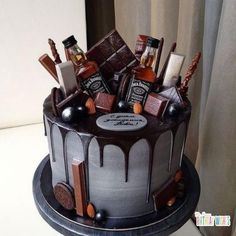 there is a chocolate cake with liquor on the top and other items in the middle