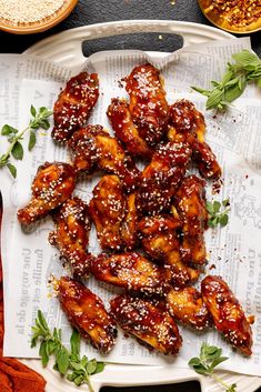 chicken wings covered in sesame seeds and sauce