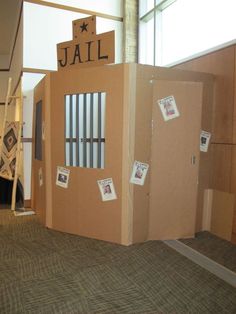 a cardboard jail cell in an office building