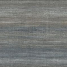 an area rug with grey and blue stripes