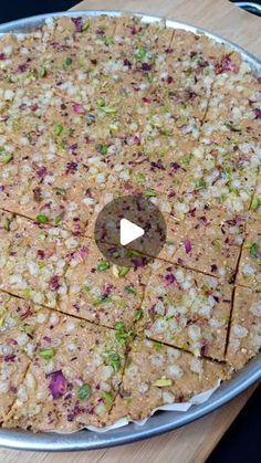 a pizza sitting on top of a pan covered in toppings