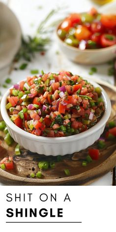 a white bowl filled with vegetables on top of a wooden plate