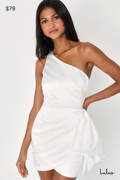 You deserve to be the center of attention, so you need a dress with the attitude to match! The Lulus All About Her White Satin One-Shoulder Bow Mini Dress is all that and more thanks to structured woven satin that perfectly showcases all your curves, shaping a darted bodice with a single tank strap and a trendy one-shoulder neckline (with hidden no-slip strips). Fitted waist tops a strategically gathered detail that continues into an oversized bow. Overlapping mini hem completes this flirty look! Hidden zipper/clasp at side. Fit: This garment fits true to size. Length: Mid-thigh. Size medium measures 32.5" from shoulder to hem. Bust: Great for any cup size. Waist: Fitted - very fitted at natural waist. Hip: Not Fitted - room for hips. Undergarments: May be worn with a strapless bra, adhesi Dress With Big Bow, Bow Mini Dress, Lulu Fashion, In The Spotlight, Big Bow, Satin Mini Dress, Strapless Bra, White Satin, Dress 100