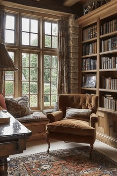 a living room filled with lots of books and furniture