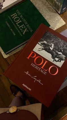 there are many books on the table together, including one for polo and another for heritage