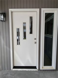 a white front door with two sidelights