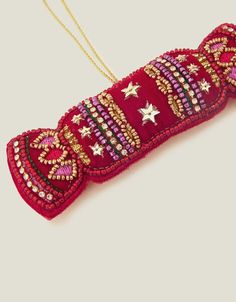 an ornament with beads and stars on it