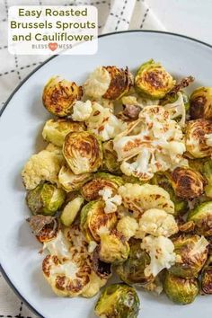 a white plate topped with brussel sprouts and cauliflower