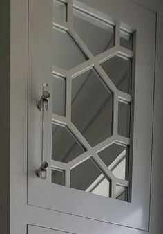 a white door with glass inserts on it