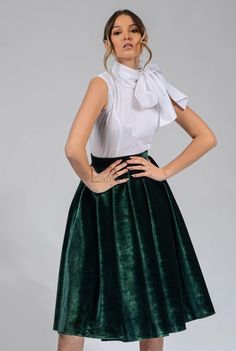 This green velvet circle skirt is a must-have for any woman's wardrobe. It's made from 100% cotton, so it's both soft and elegant. The skirt has a high waist and a full circle skirt, which gives it a flattering and feminine look. The skirt is also lined, so it's comfortable to wear. This skirt is perfect for any occasion, from a night out to a special event. It can be dressed up or down, depending on the occasion. The green color is versatile and can be paired with a variety of tops and accessor Green Flowy Party Skirt, Green A-line Skirt For Party, Elegant Green Mini Skirt For Party, Green Flowy Skirt For Party, Green Midi Skirt Dress For Party, Green Midi Skirt For Evening, Green Pleated Party Skirt, Chic Green Full Skirt, Green Long Skirt For Party