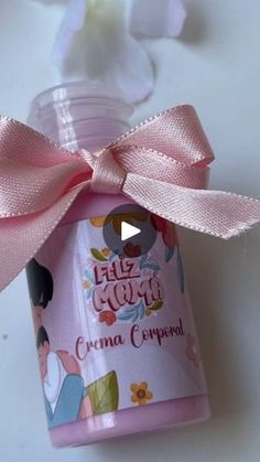 a bottle with a pink bow on it