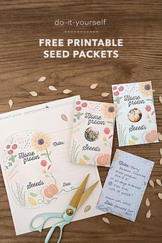 three seed packets with scissors and paper on a wooden table next to them is a note card that says, do - it - yourself free printable seed packet