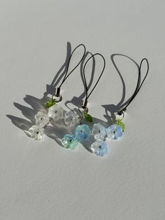 three necklaces with different colored glass beads