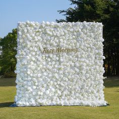 a large white flowered wall with the words rose morning on it's side