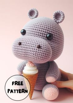 a crocheted hippo with an ice cream cone in its mouth and the caption free pattern