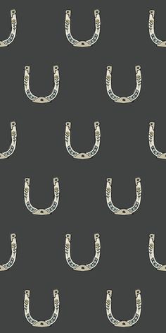 a black and white pattern with an image of a pair of horseshoes on it