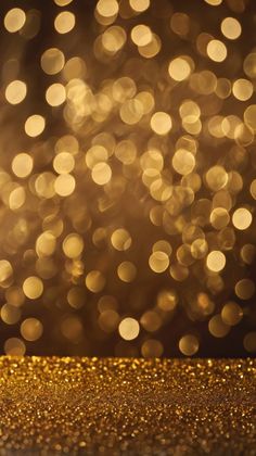 a gold glitter background with lots of small circles