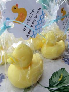 rubber ducks are wrapped in plastic on a table