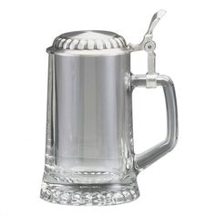 a glass beer mug with a metal handle